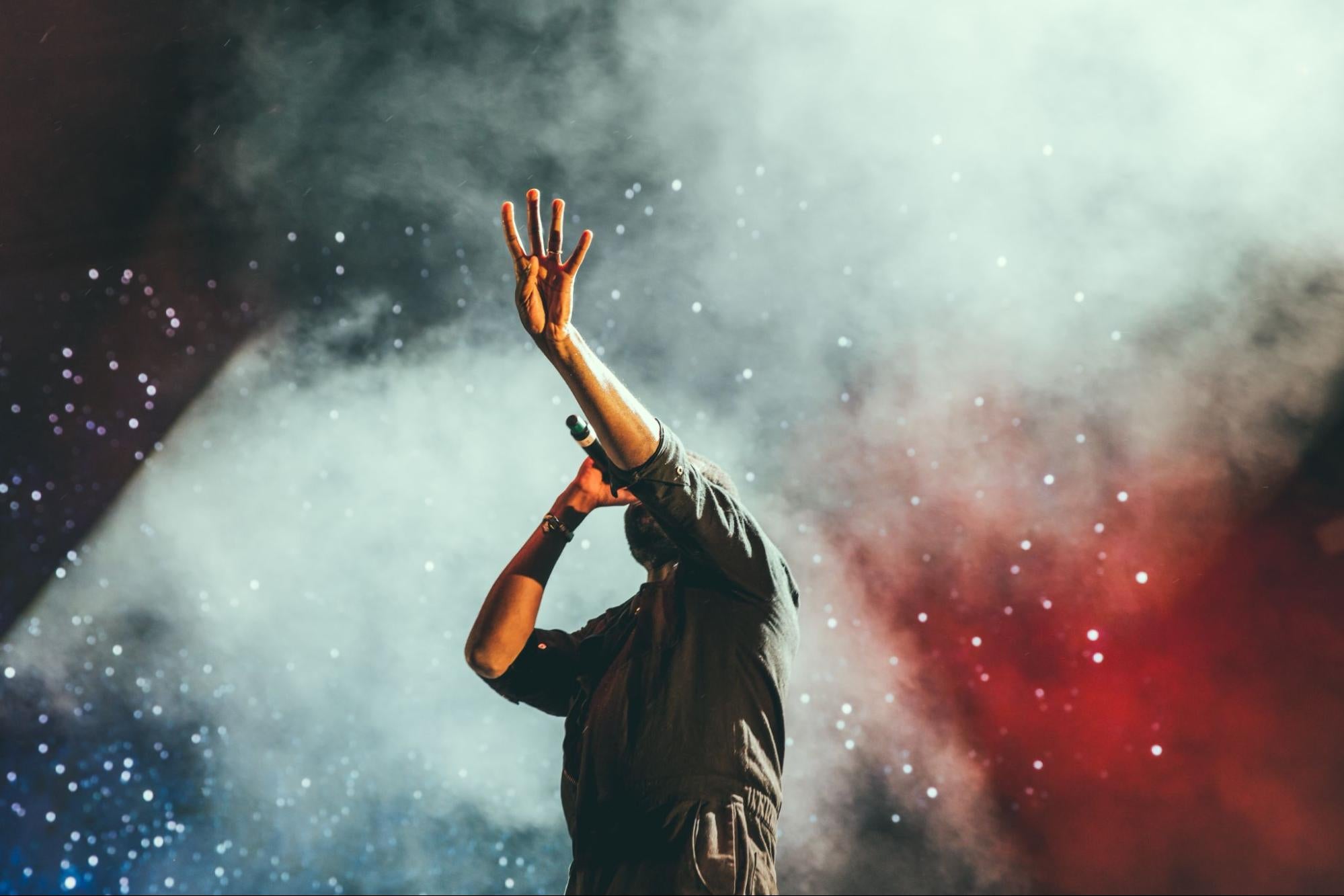 Artist onstage with microphone.